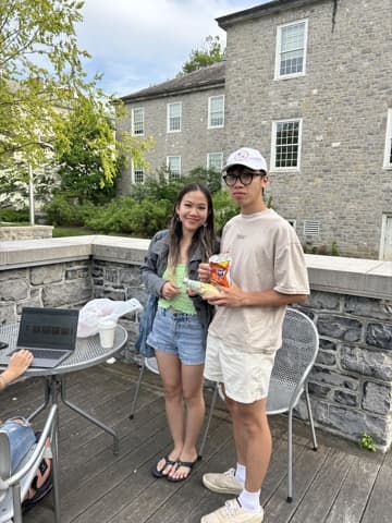 Friends enjoying snacks together on an outdoor patio