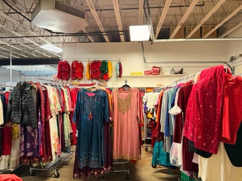 Colorful South Asian clothing on racks in a local boutique